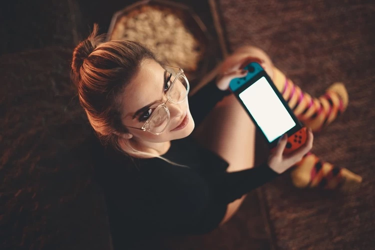 girl playing on nintendo switch gaming console